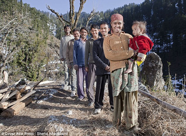 Happy family: Five brothers (L-R) Sant Ram Verma, 28, Bajju Verma, 32, Gopal Verma, 26, Guddu Verma, 21, and Dinesh Verma, 19, with their shared wife Rajo Verma, 20, and their son Jay Verma