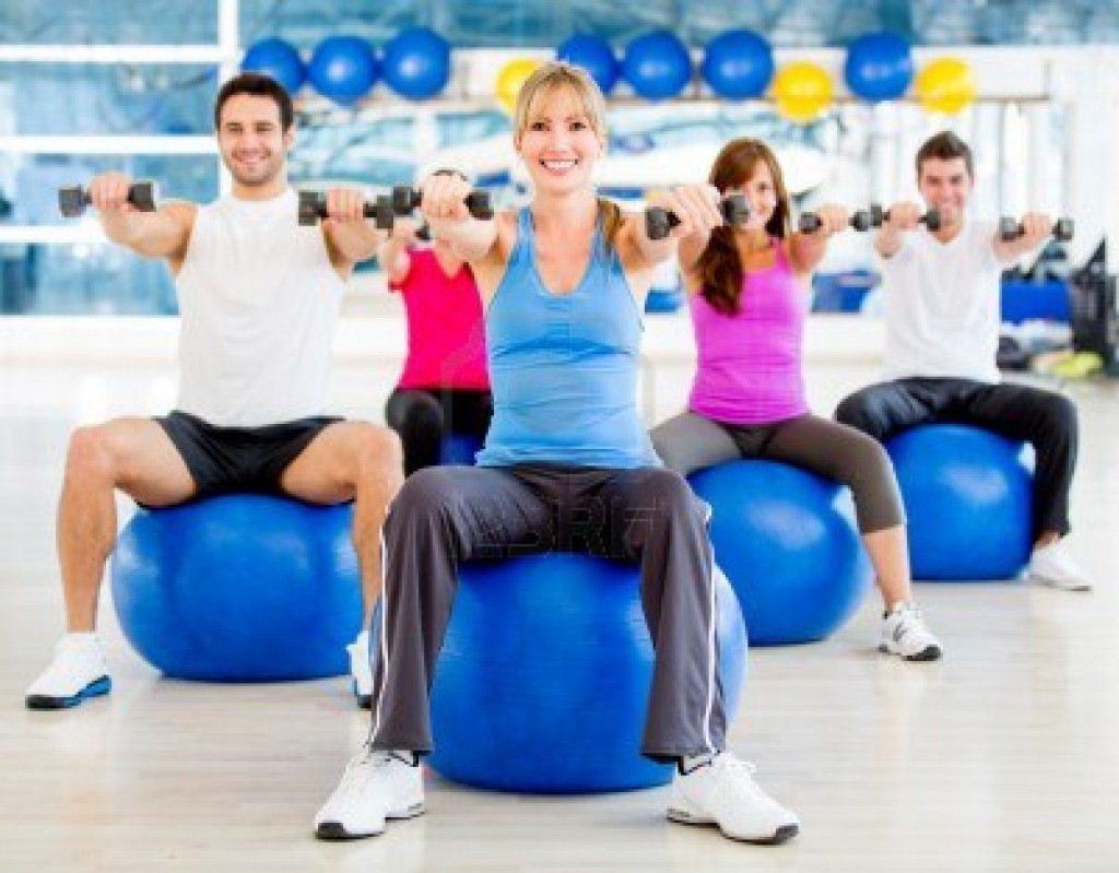14748817-group-of-people-exercising-at-the-gym